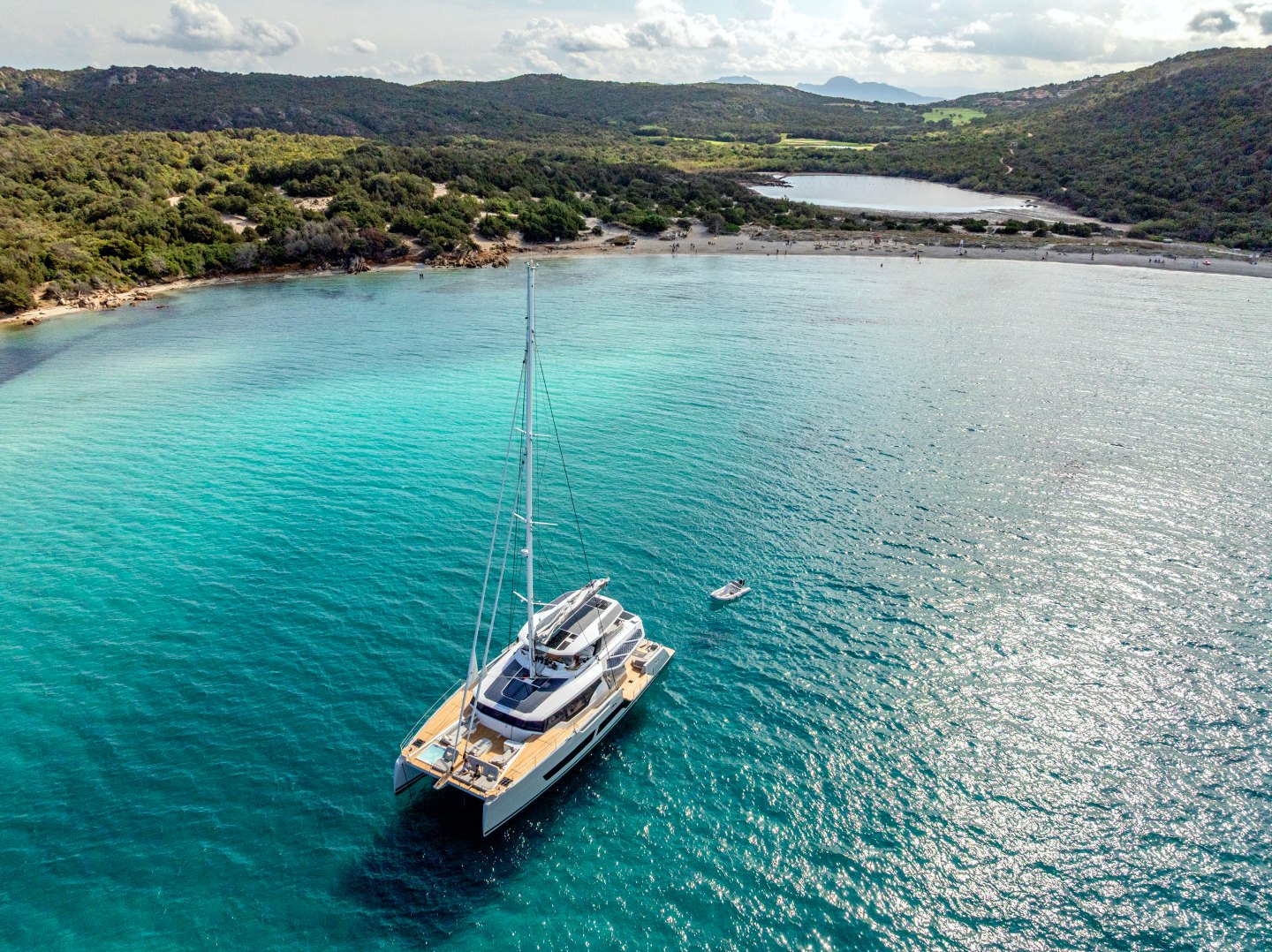 WINDKIND at anchor in a turquoise bay off Sardinia
