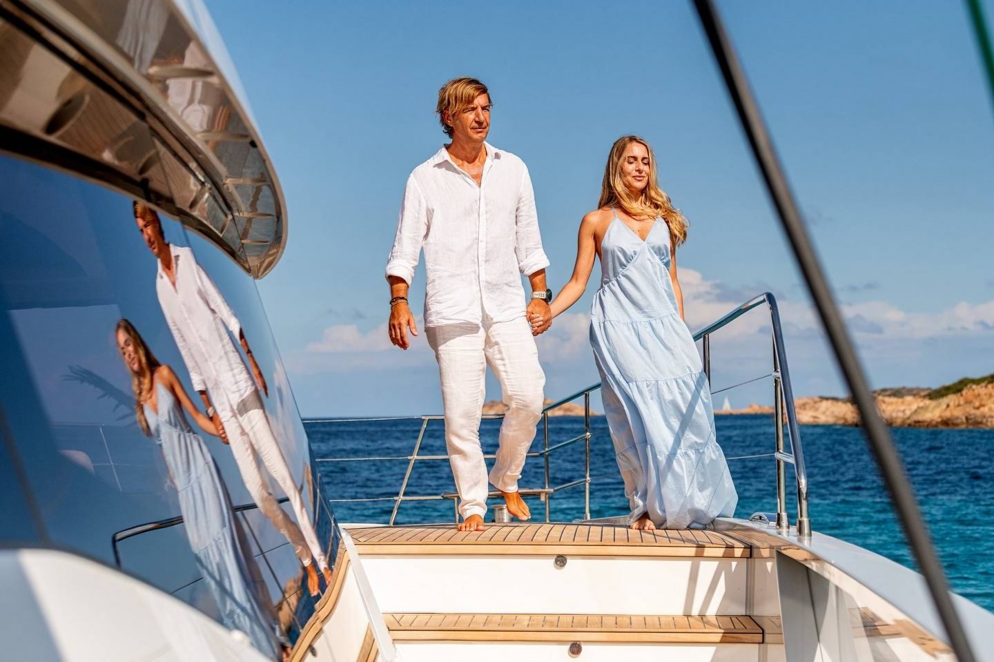Couple relaxing on the bow of WINDKIND