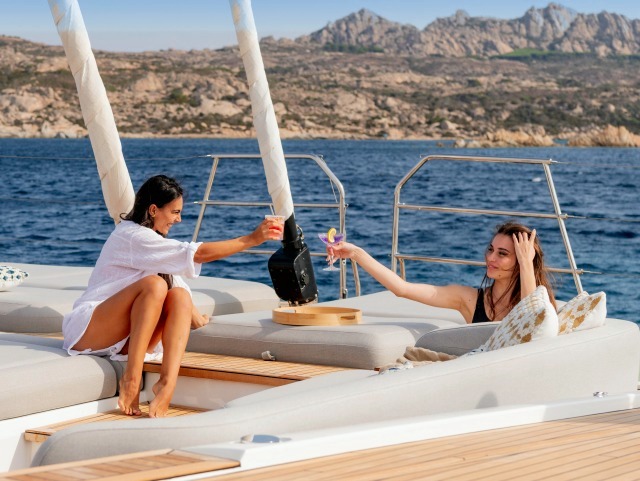 Two guests toasting on the forward lounge