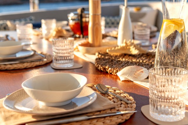 Table set with woven placemats and glassware